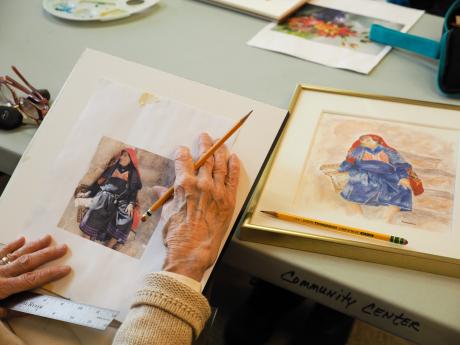 Elderly woman drawing